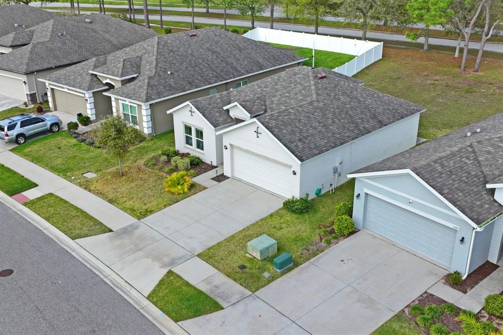 571 Old Windsor Way Spring Hill, FL 34609 - Photo 50 of 61 a aerial view of a house with a yard