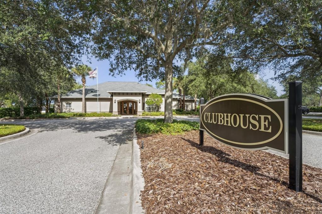 571 Old Windsor Way Spring Hill, FL 34609 - Photo 52 of 61 a front view of a house with garden