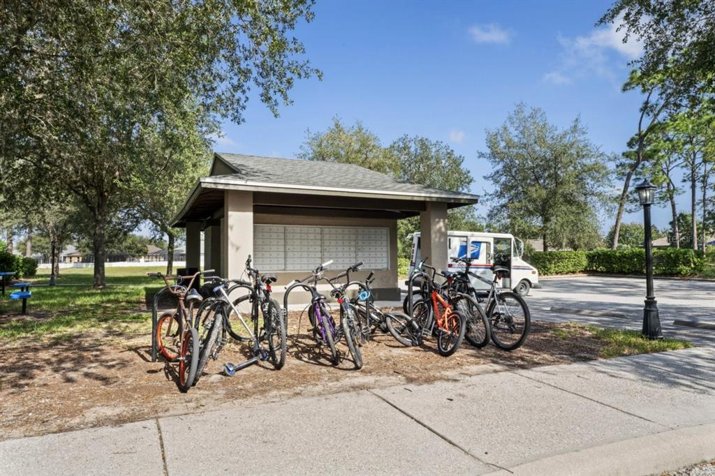 571 Old Windsor Way Spring Hill, FL 34609 - Photo 58 of 61 a front view of a house with garden