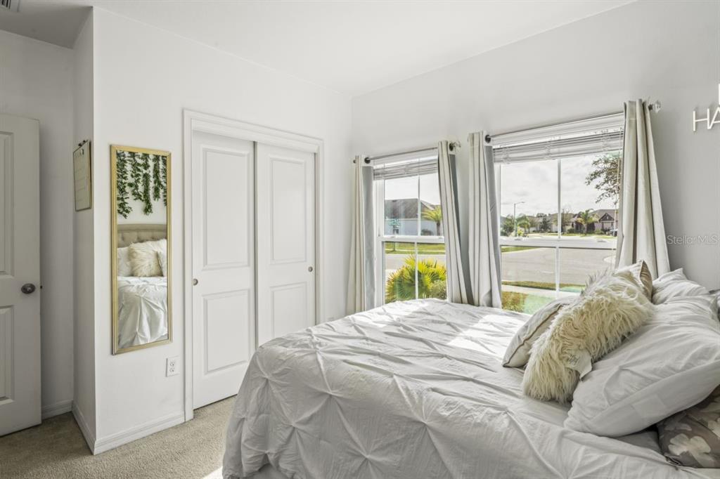 571 Old Windsor Way Spring Hill, FL 34609 - Photo 9 of 61 a bedroom with a bed and a window