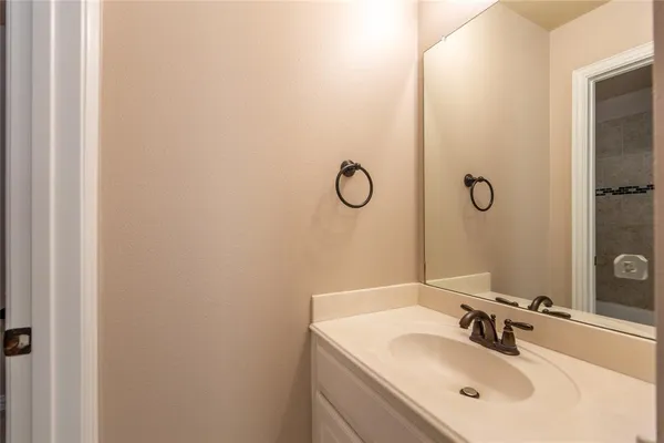 a bathroom with a sink and mirror