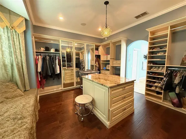 a kitchen with stainless steel appliances granite countertop a stove and a refrigerator