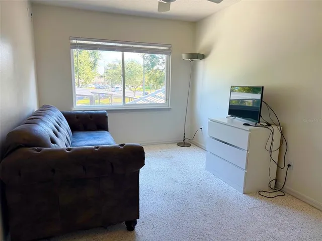 a living room with furniture and a window