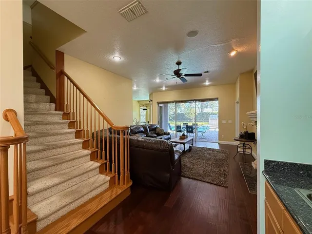 a very nice looking living room with wooden floor and a window