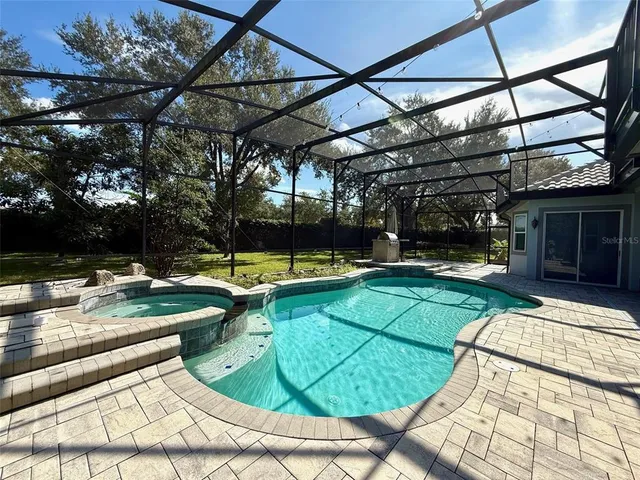 a view of a swimming pool with a patio