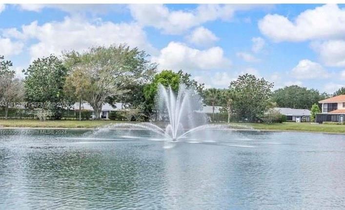 18428 Vía Di Regina Boca Raton, FL 33496 - Photo 1 of 6 a view of yard with swimming pool and trees in the background
