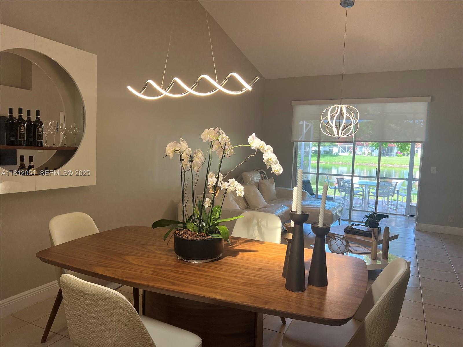 18428 Vía Di Regina Boca Raton, FL 33496 - Photo 5 of 6 a dining room with furniture and window