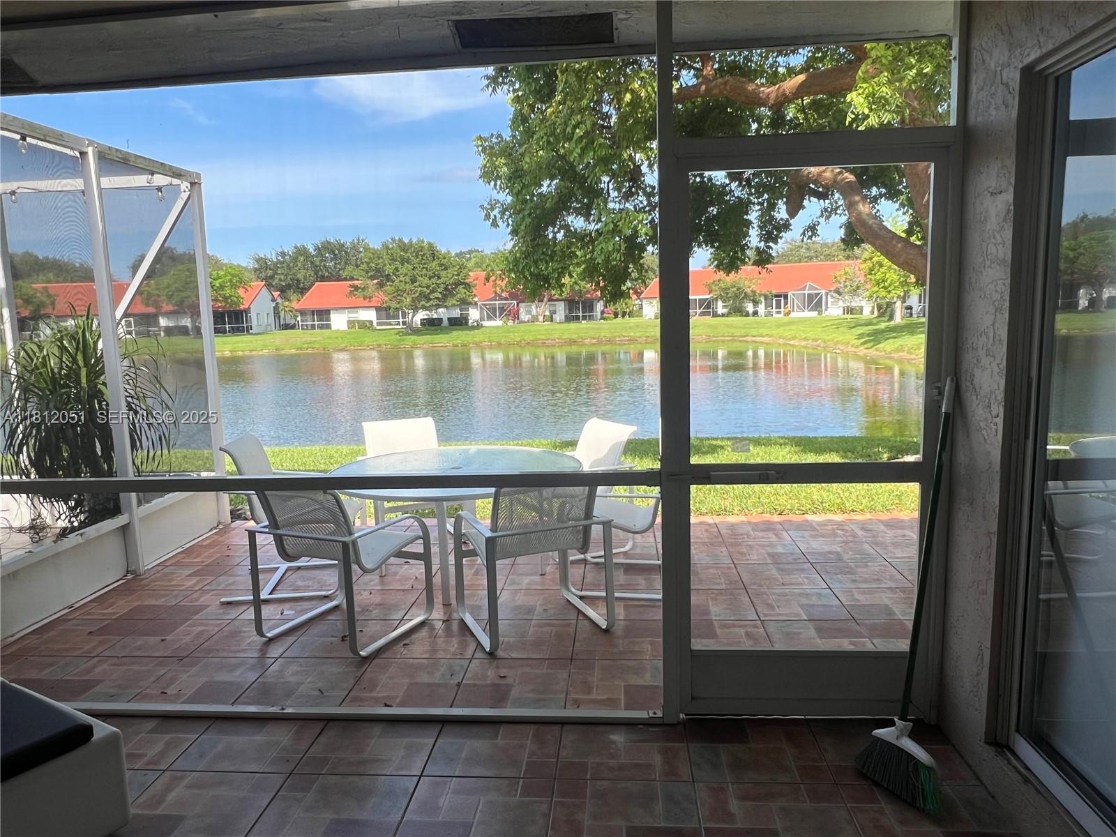 18428 Vía Di Regina Boca Raton, FL 33496 - Photo 6 of 6 a view of swimming pool from a balcony