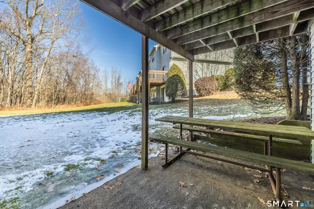 a living room with a table and a window