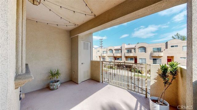 a view of balcony with furniture