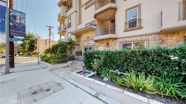 a view of a building with potted plants