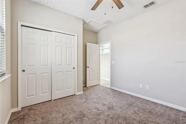 an empty room with closet area