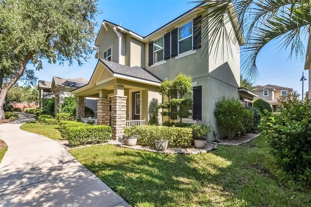1108 Lincoln Ridge Loop Ocoee, FL 34761 - Photo 2 of 32 a front view of a house with a yard