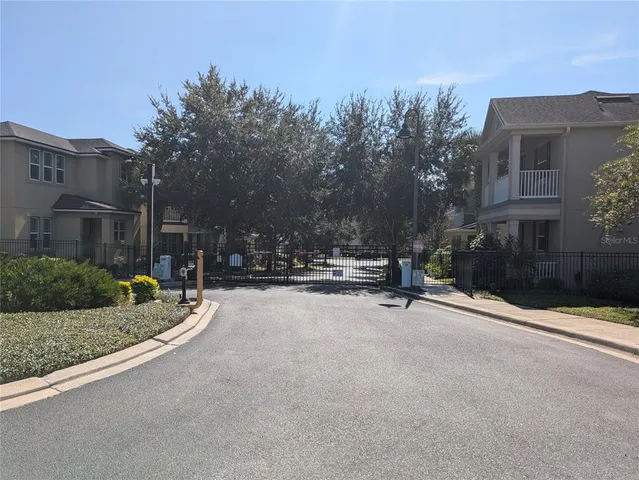 a view of a street with houses on both side