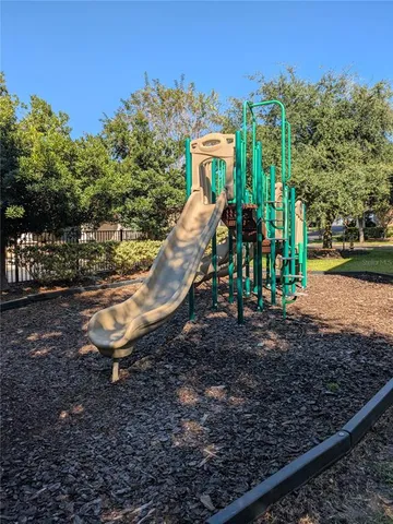 a view of a park with iron fence