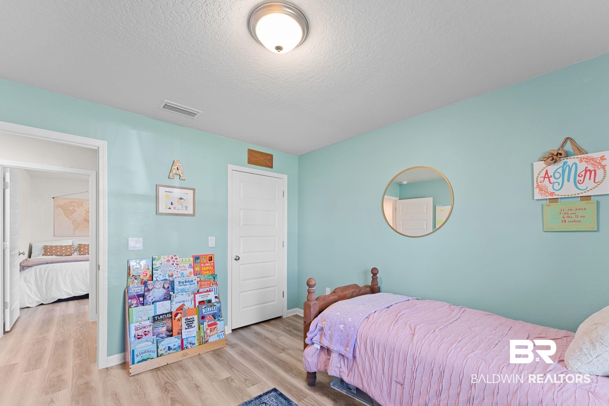 24337 Ringneck Loop Elberta, AL 36530 - Photo 26 of 34 Bedroom featuring wood finished floors and a textured ceiling