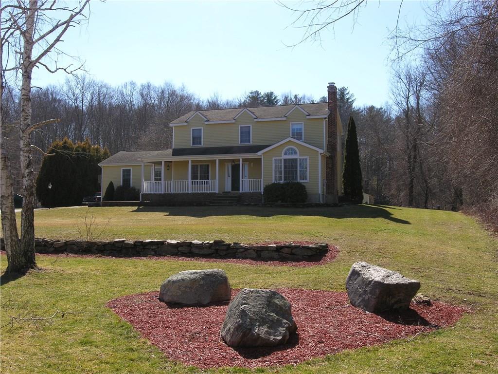 a view of a house with swimming pool and a yard