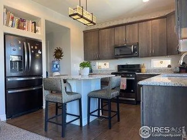 a kitchen with a sink cabinets and stainless steel appliances