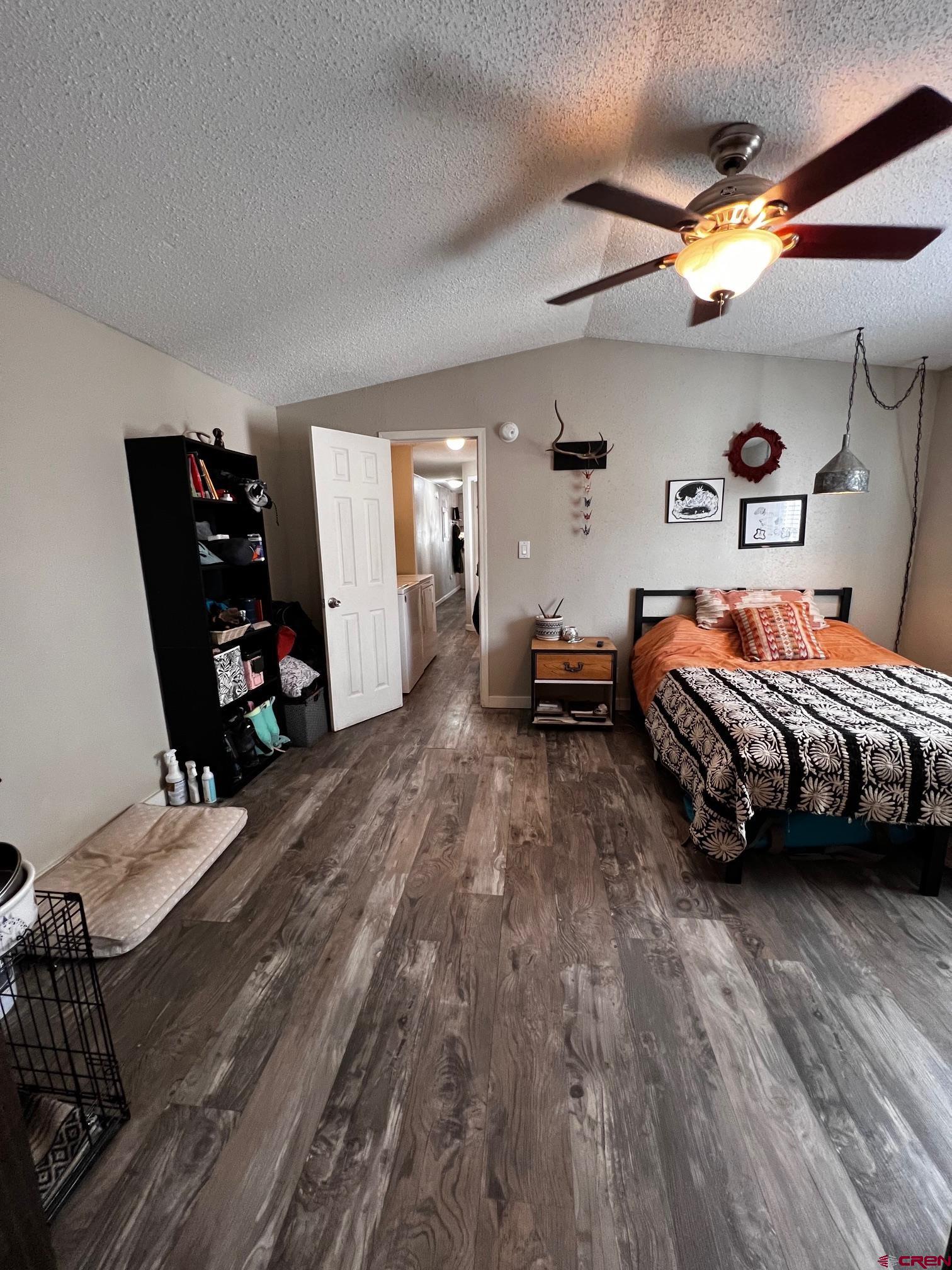 288 Animas View Drive, Unit 39 Durango, CO 81301 - Photo 11 of 14 a bedroom with bed and a wooden floor