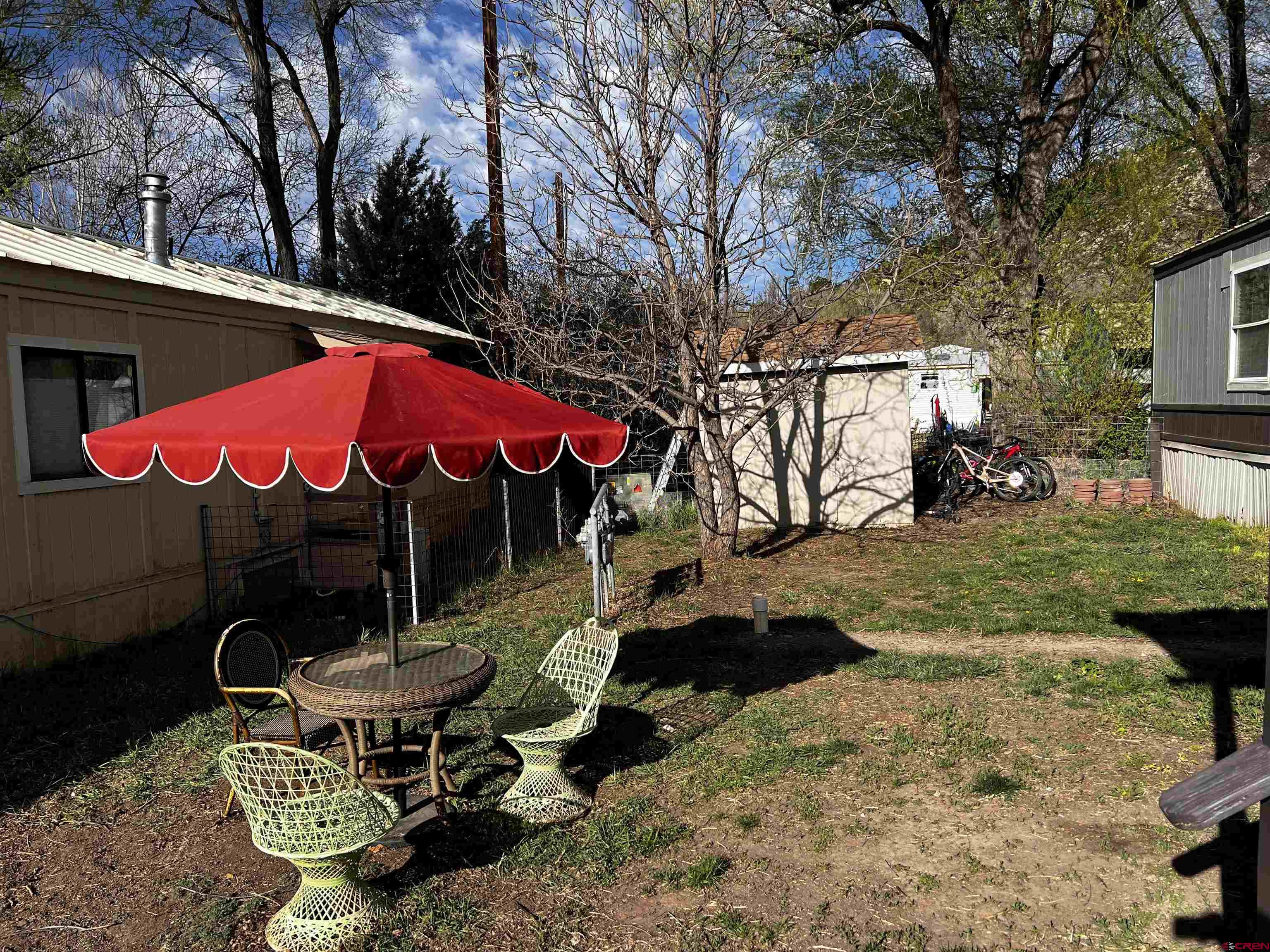 288 Animas View Drive, Unit 39 Durango, CO 81301 - Photo 12 of 14 a view of a chairs and table in backyard