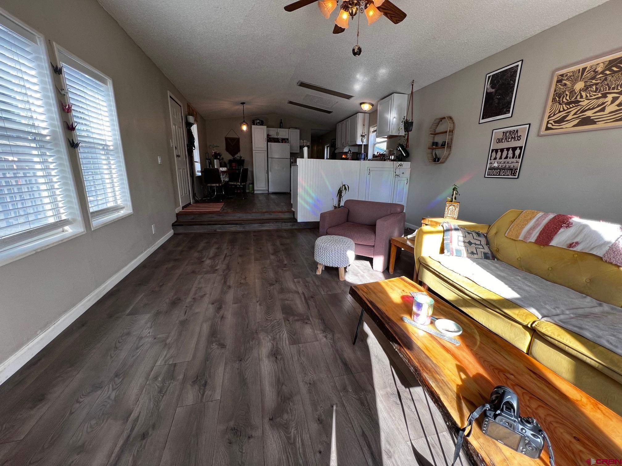 288 Animas View Drive, Unit 39 Durango, CO 81301 - Photo 3 of 14 a living room with lots of furniture and kitchen view