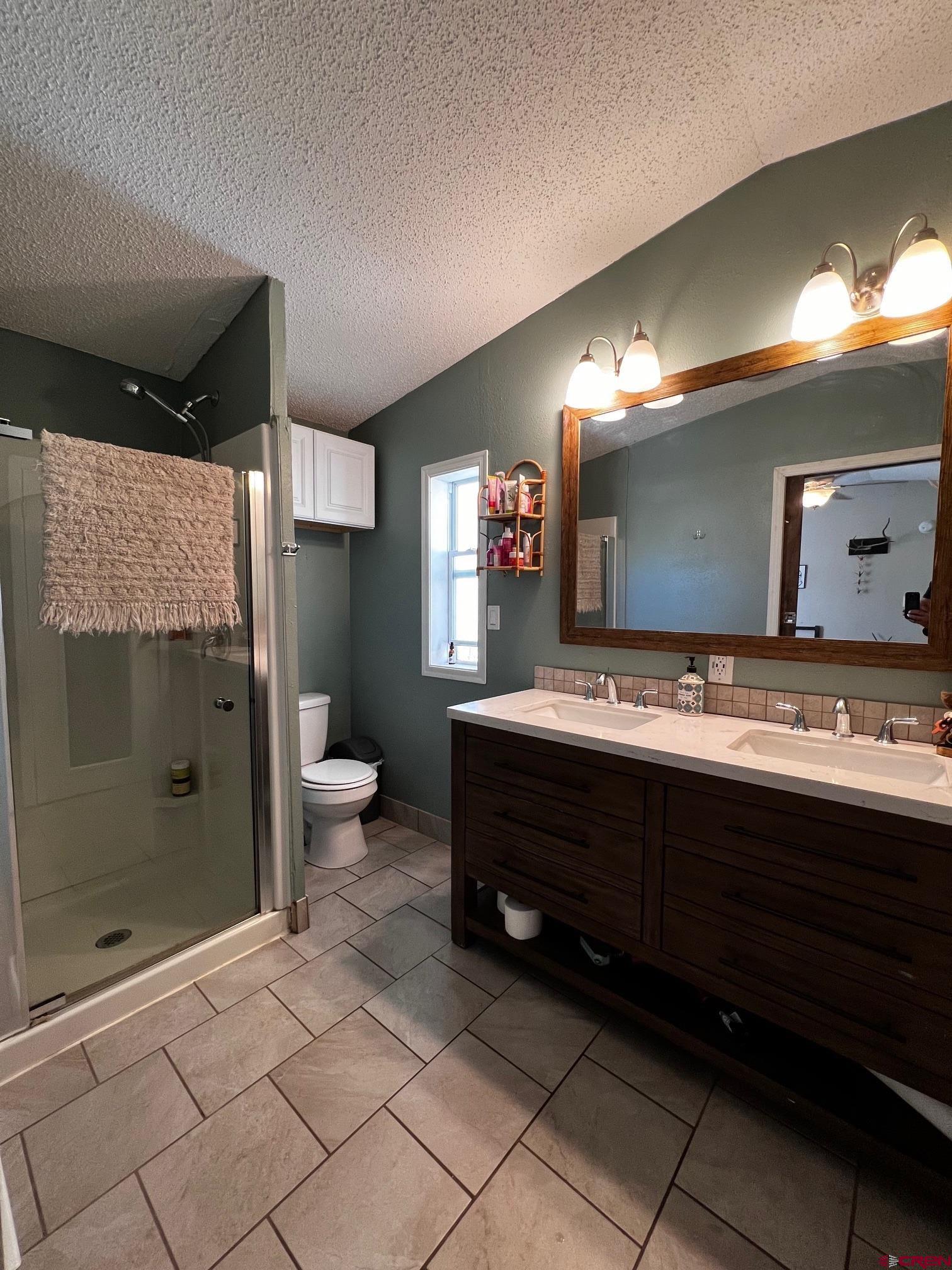 288 Animas View Drive, Unit 39 Durango, CO 81301 - Photo 10 of 14 a bathroom with a sink and a mirror