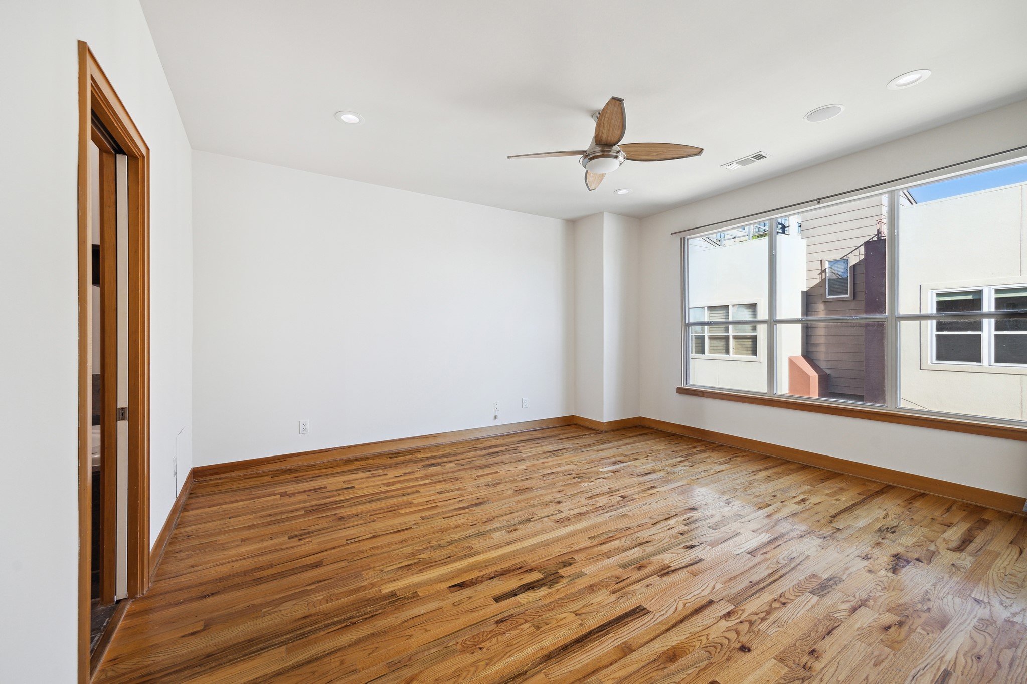 94 Drew Street, Unit C Houston, TX 77006 - Photo 17 of 29 Spacious primary suite filled with natural light, creating a bright and airy retreat that feels both relaxing and refined.