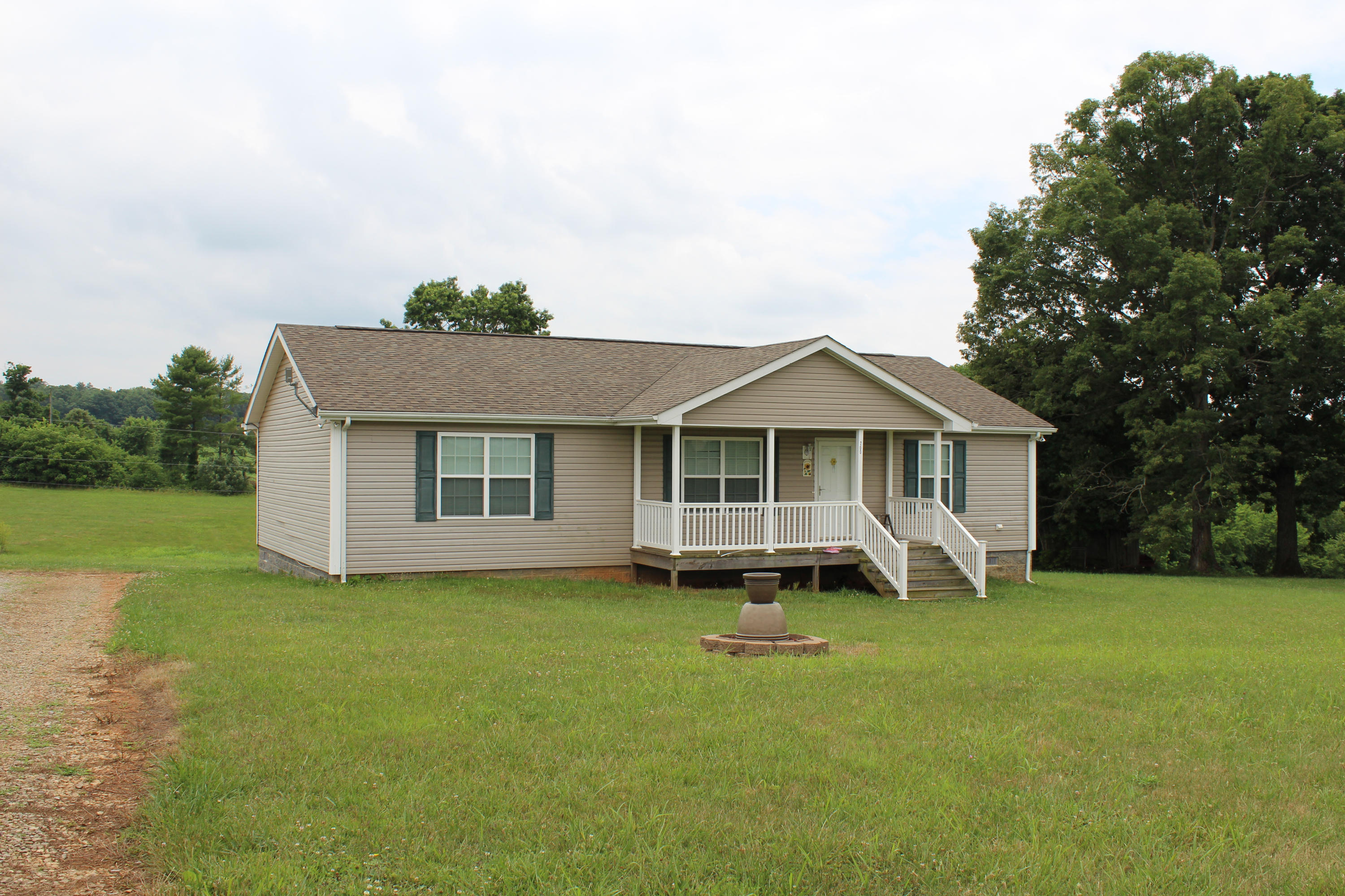 200 Kent Road Wirtz, VA 24184 - Photo 29 of 30 a front view of a house with a yard and garage