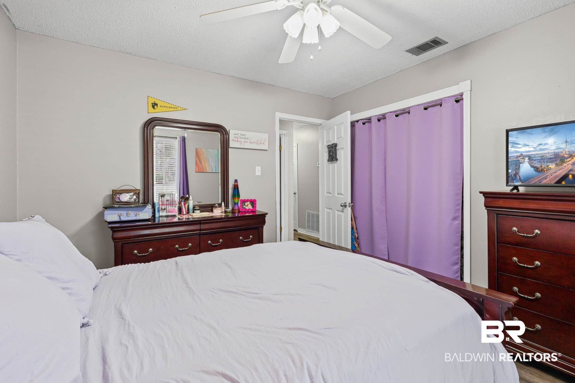 6609 Blakeley Court Mobile, AL 36695 - Photo 17 of 28 Bedroom featuring ceiling fan and a textured ceiling