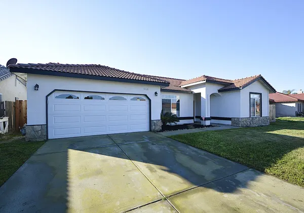 a house view with a backyard space