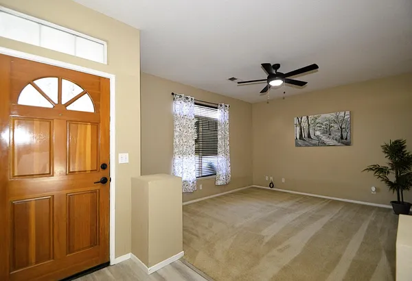 a view of an empty room with a window
