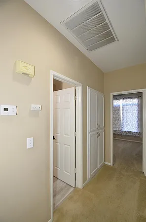 a view of a hallway with closet area