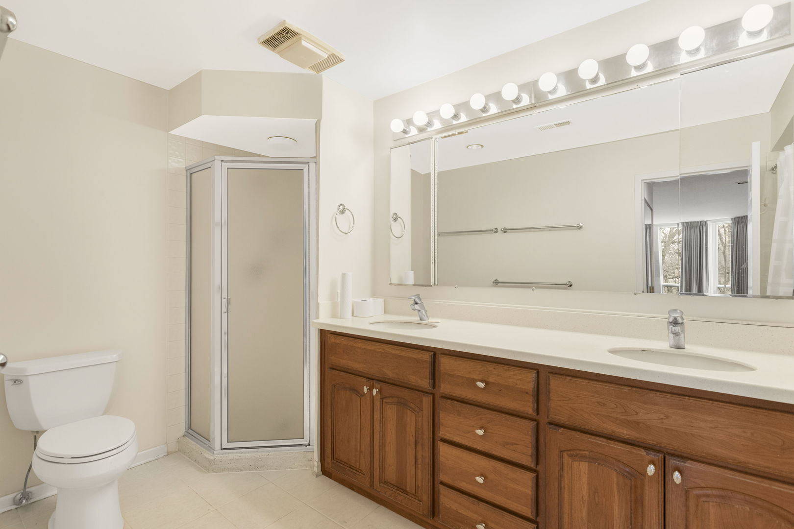1140 Old Mill Road, Unit 304F Hinsdale, IL 60521 - Photo 12 of 21 a bathroom with a granite countertop sink mirror and toilet