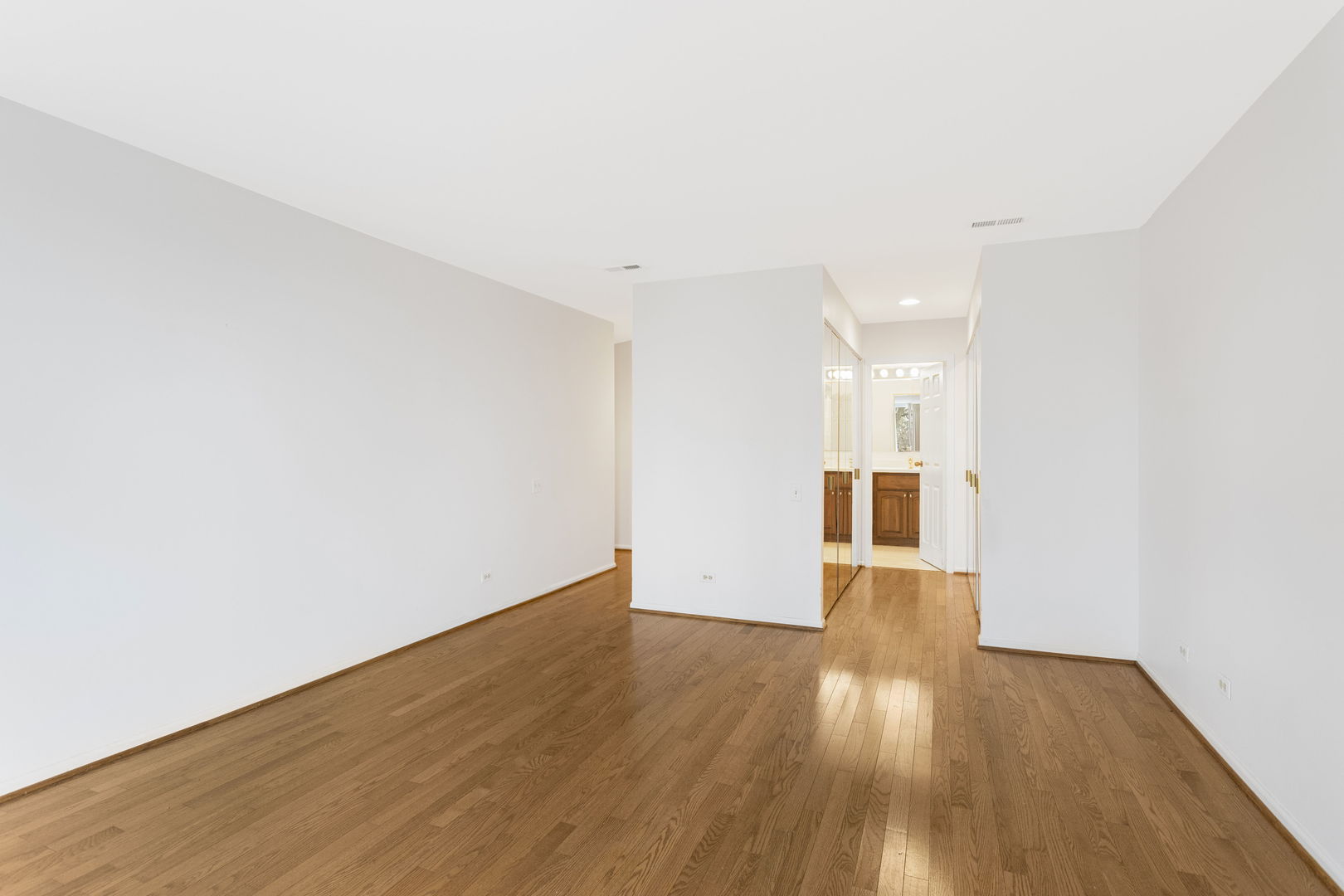1140 Old Mill Road, Unit 304F Hinsdale, IL 60521 - Photo 15 of 21 a view of empty room with wooden floor