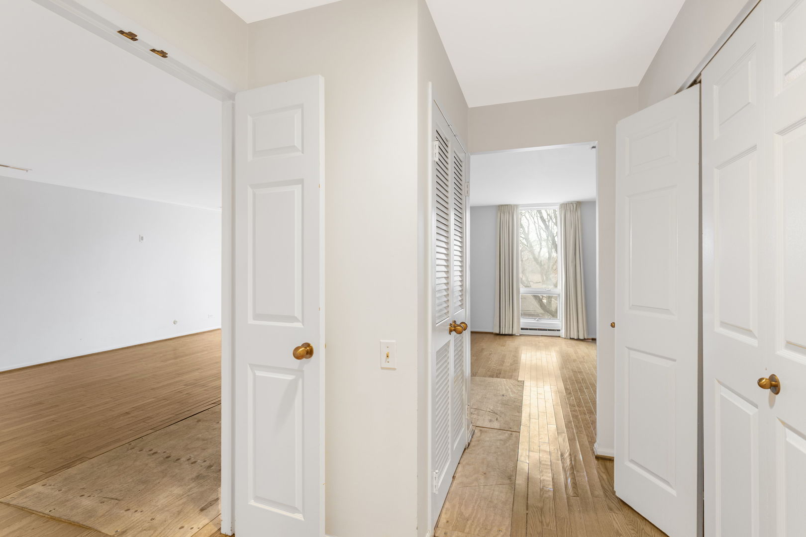 1140 Old Mill Road, Unit 304F Hinsdale, IL 60521 - Photo 16 of 21 a view of a hallway with wooden floor