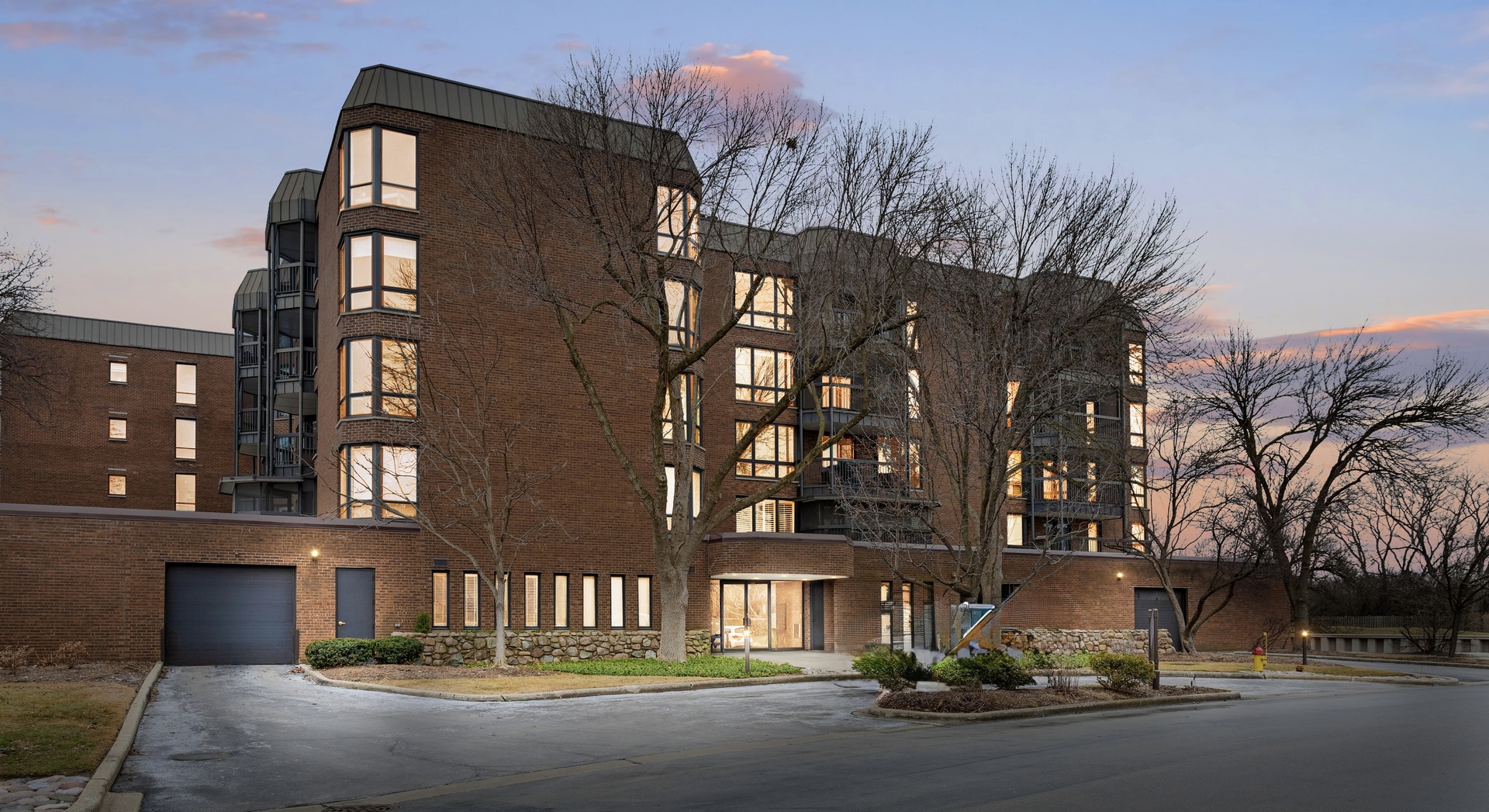 1140 Old Mill Road, Unit 304F Hinsdale, IL 60521 - Photo 20 of 21 a front view of a building with street view