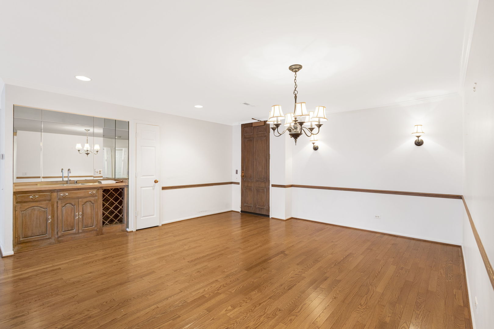 1140 Old Mill Road, Unit 304F Hinsdale, IL 60521 - Photo 4 of 21 a view of a kitchen with a sink a stove top oven and cabinetry