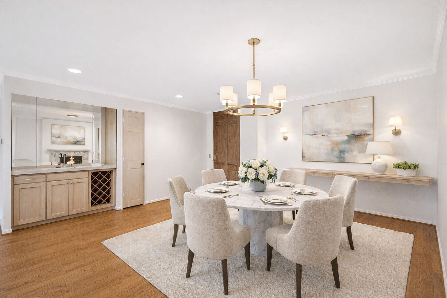 1140 Old Mill Road, Unit 304F Hinsdale, IL 60521 - Photo 5 of 21 a view of a dining room and livingroom with furniture wooden floor a rug and a chandelier