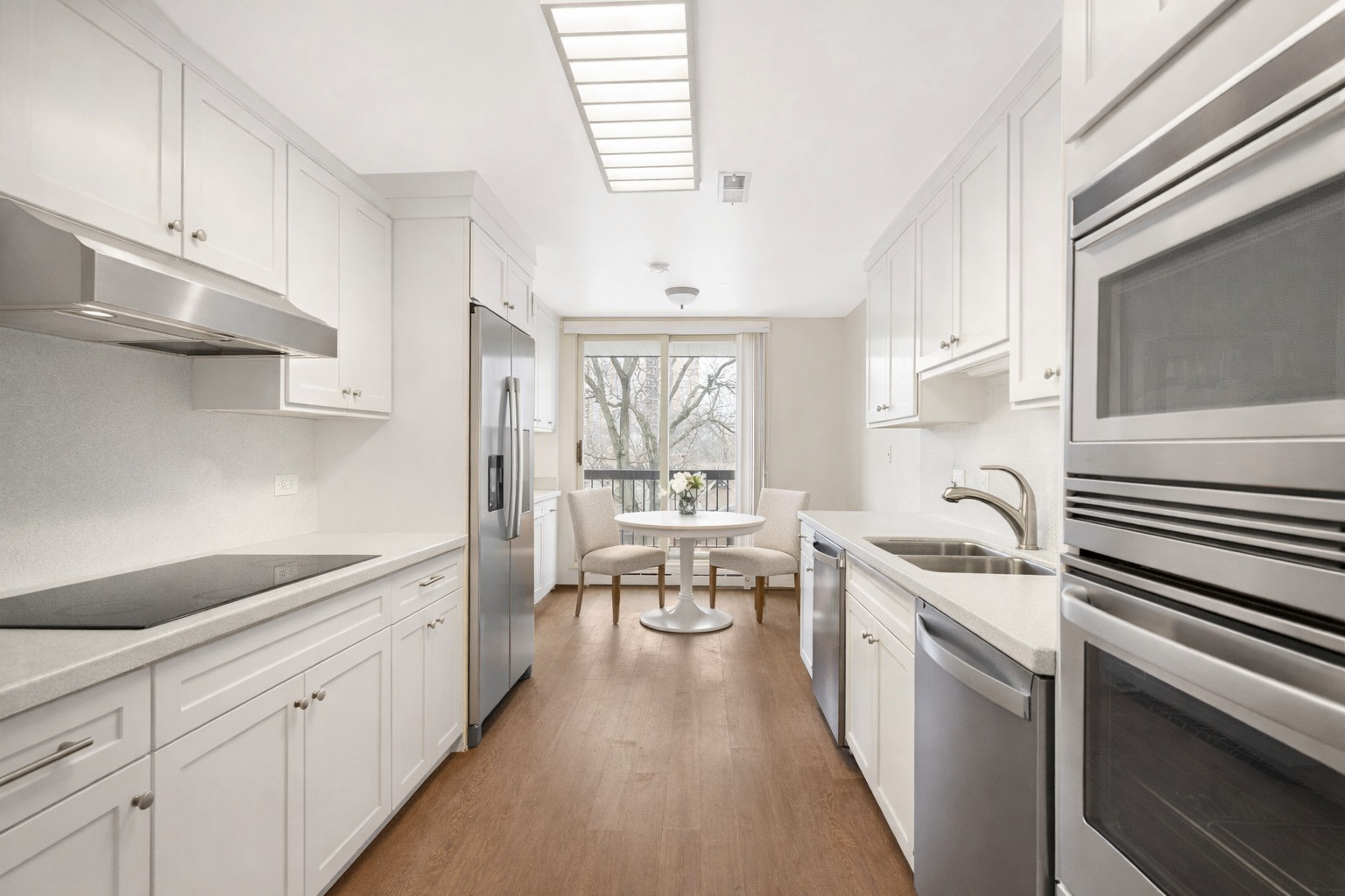 1140 Old Mill Road, Unit 304F Hinsdale, IL 60521 - Photo 9 of 21 a kitchen with granite countertop a sink stove and cabinets