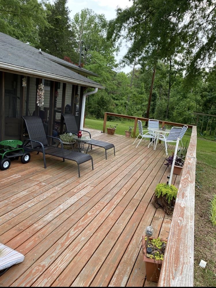 755 Old Toone Road Toone, TN 38381 - Photo 10 of 25 a view of a patio with chairs and table on the wooden floor