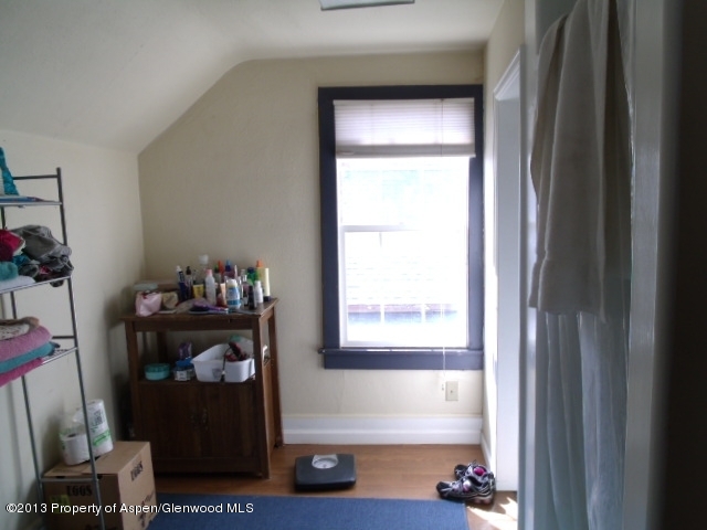 126 West 4th Street Rifle, CO 81650 - Photo 5 of 16 a room that has a bed and a window in it