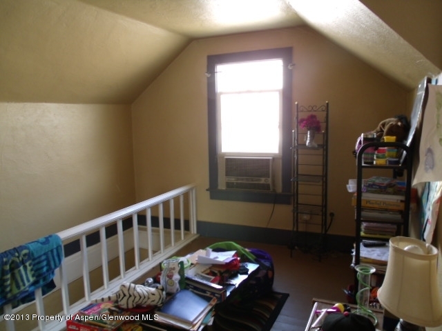 126 West 4th Street Rifle, CO 81650 - Photo 6 of 16 a bedroom with furniture and a window