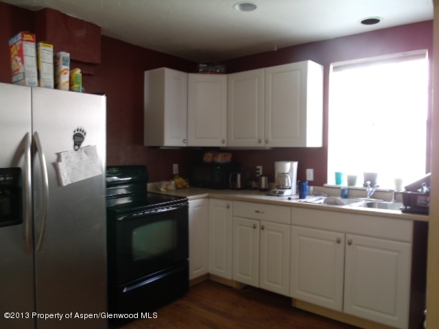 126 West 4th Street Rifle, CO 81650 - Photo 10 of 16 a kitchen with a sink and cabinets