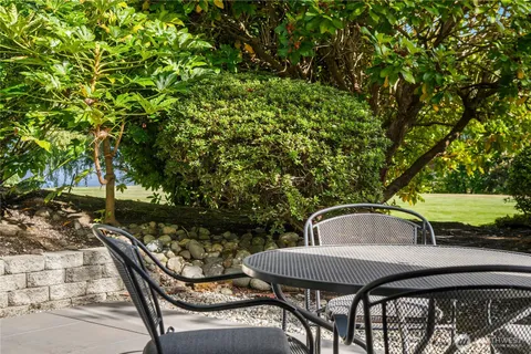 a view of a chairs and table in the patio