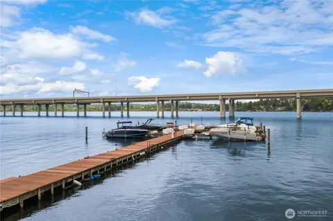a view of swimming pool with outdoor seating and city view