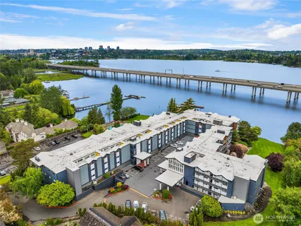 a view of a lake with couches near an ocean