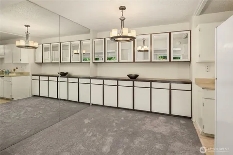 a view of a kitchen with electric appliances