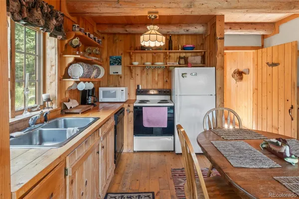 a kitchen with refrigerator and window