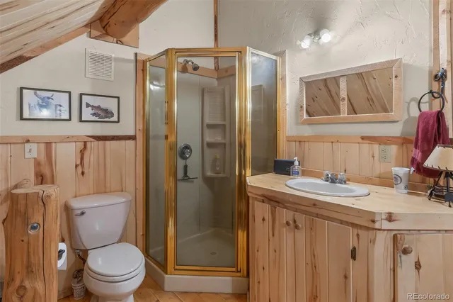 a bedroom with a bed next to a window with outer view and chair