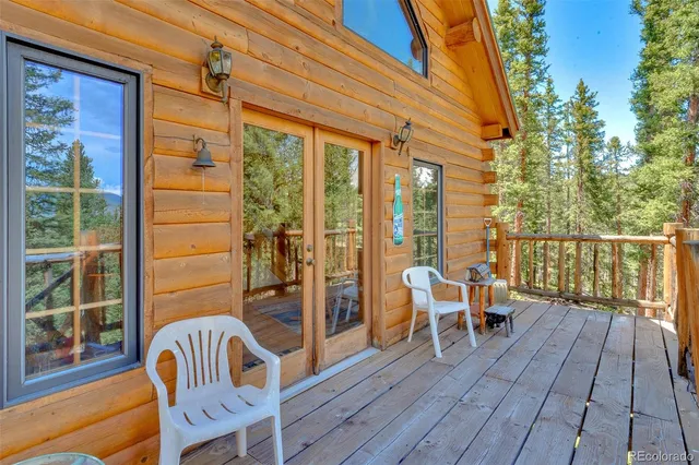 a view of backyard with brick wall and fence